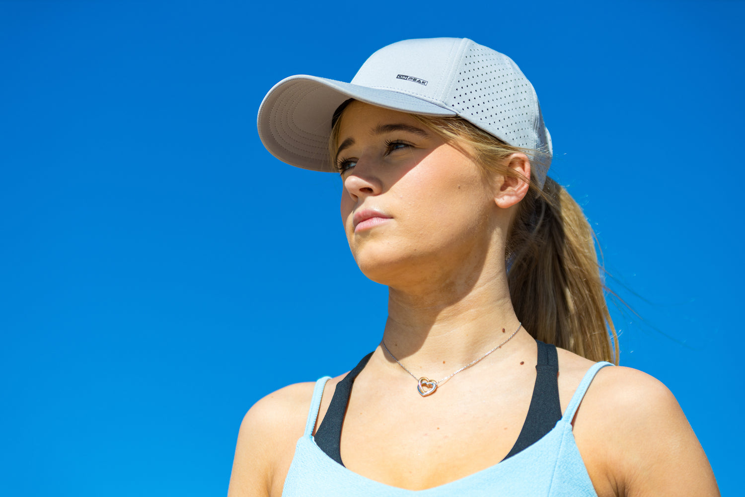 Engaging homepage video showcasing the Onpeak Performance Cap in action. The video features athletes in diverse settings, including running, gym workouts, and outdoor activities, demonstrating the cap's versatility as a running hat, gym hat, and sports hat. The cap's advanced features, such as UV protection, antimicrobial sweatband, buoyant visor core, and moisture-wicking technology, are elegantly highlighted, emphasizing its style and performance for various active pursuits.